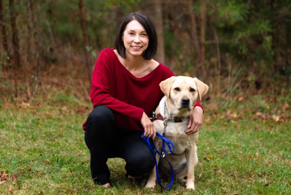 Auna Namkung, LCSWA, poses with her seeing eye dog